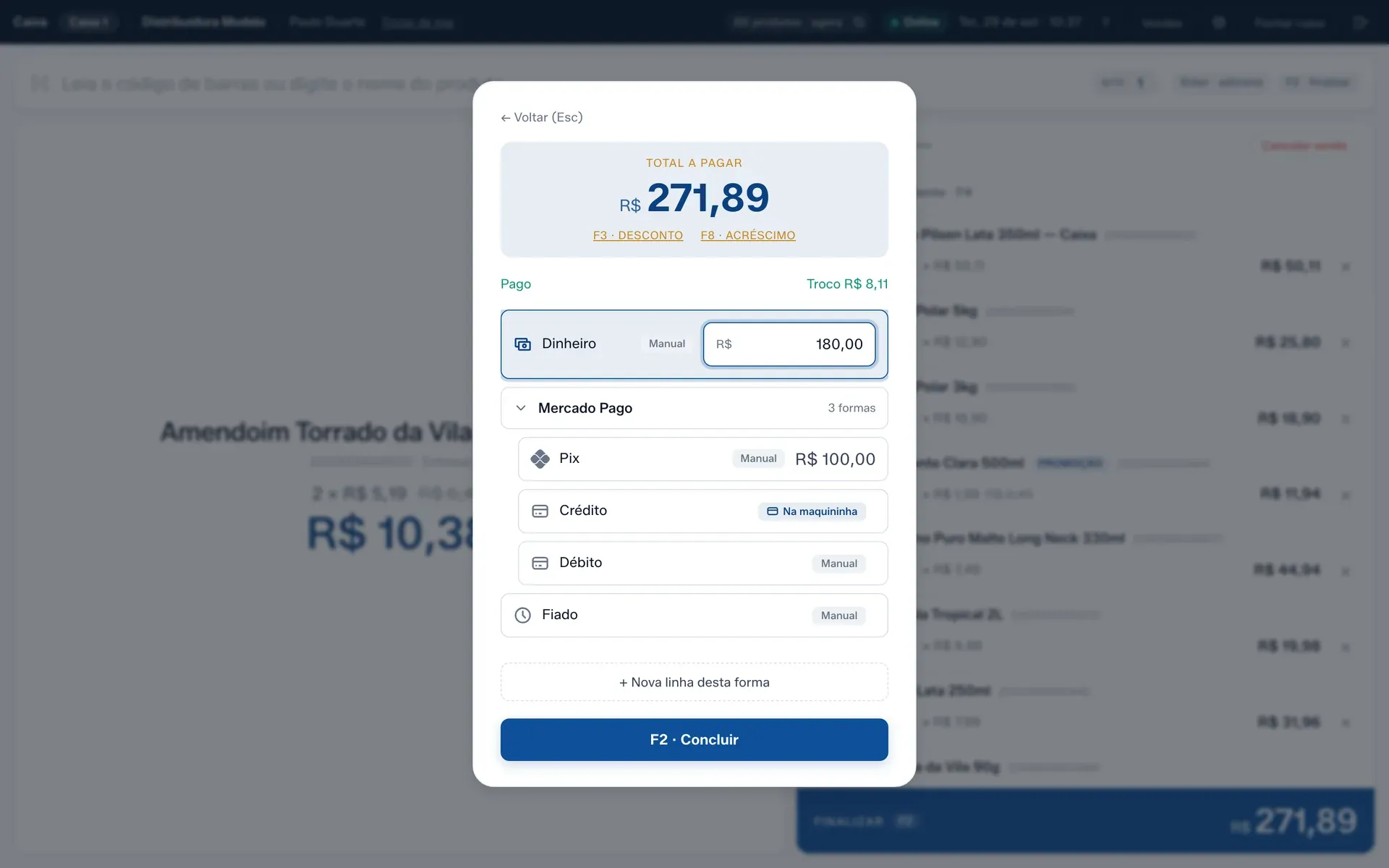 A tela de pagamento com Pix e Dinheiro na mesma venda e o troco em destaque.